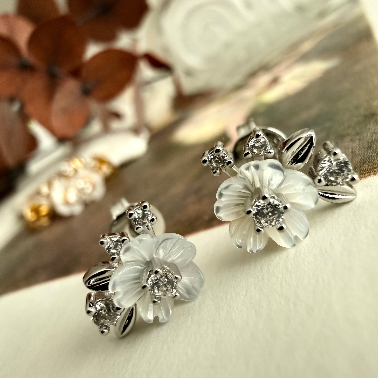 Amelia mother of pearl flower and rhinestone stud earrings in silver