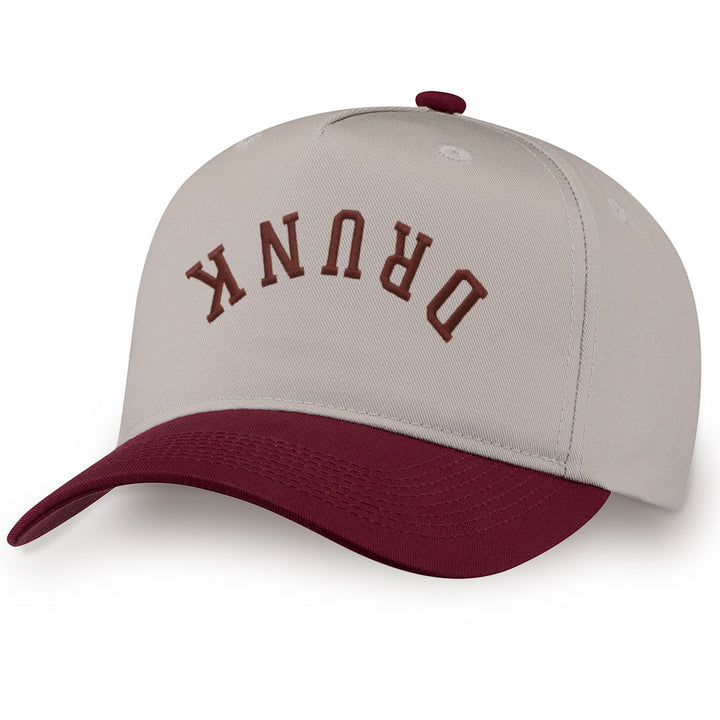 Burgundy embroidered snapback hat with DRUNK stitched across the front