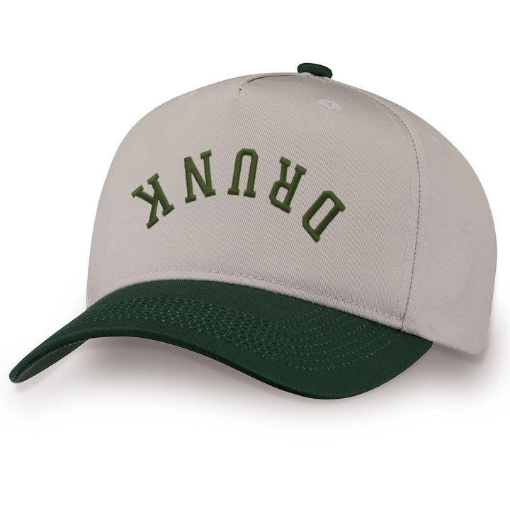 Green embroidered snapback hat with DRUNK stitched across the front