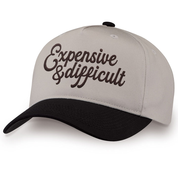 Black embroidered snapback hat with Expensive &amp; Difficult stitched across the front