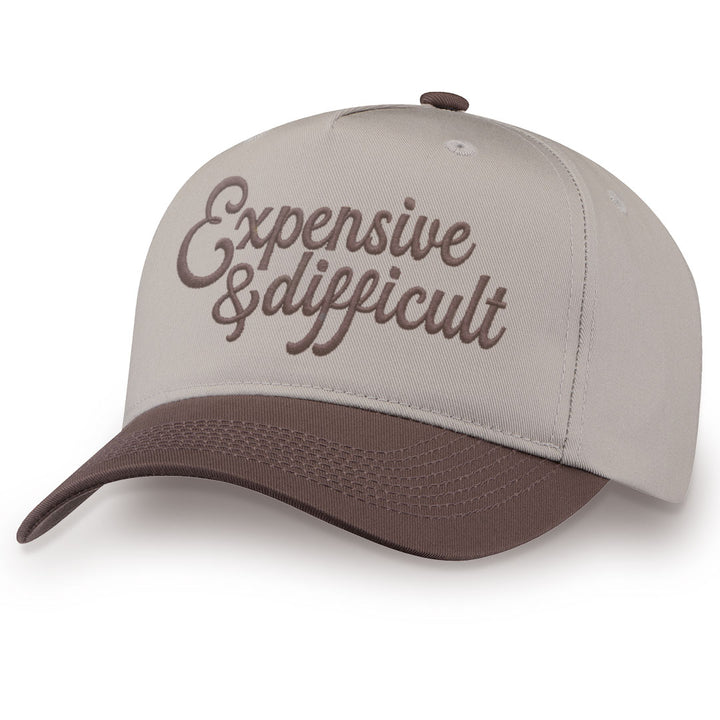 Brown embroidered snapback hat with Expensive &amp; Difficult stitched across the front