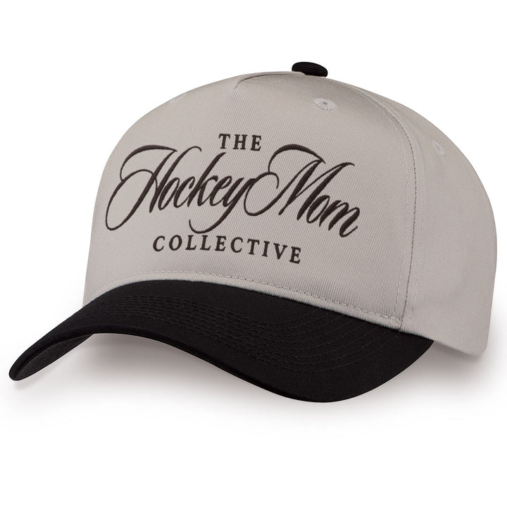 Black embroidered snapback hat with Hockey Mom stitched across the front