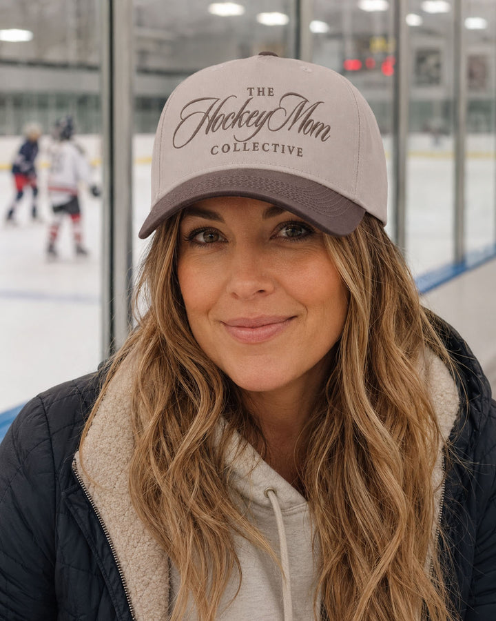 Hockey Mom embroidered snapback hat in Brown, worn