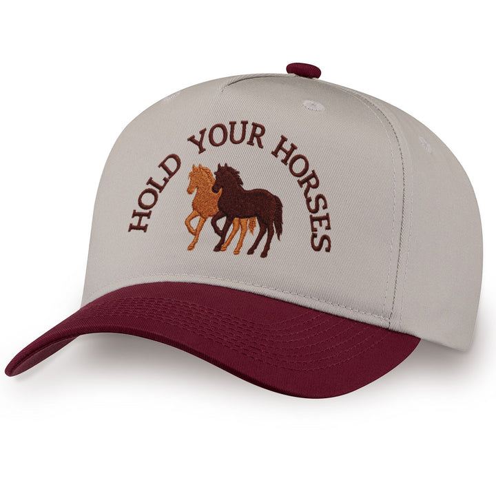 Burgundy embroidered snapback hat with Hold Your Horses stitched across the front