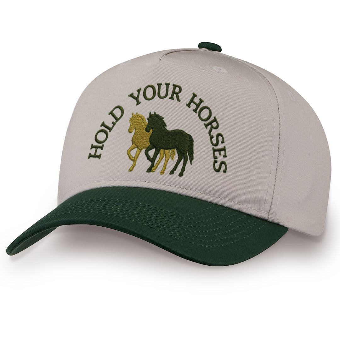 Green embroidered snapback hat with Hold Your Horses stitched across the front
