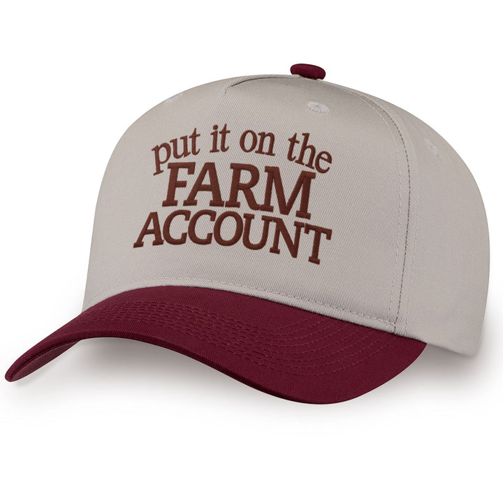 Burgundy embroidered snapback hat with Farm Account stitched across the front