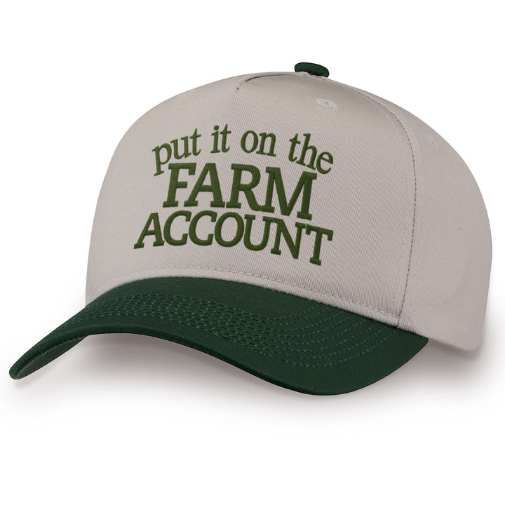Green embroidered snapback hat with Farm Account stitched across the front