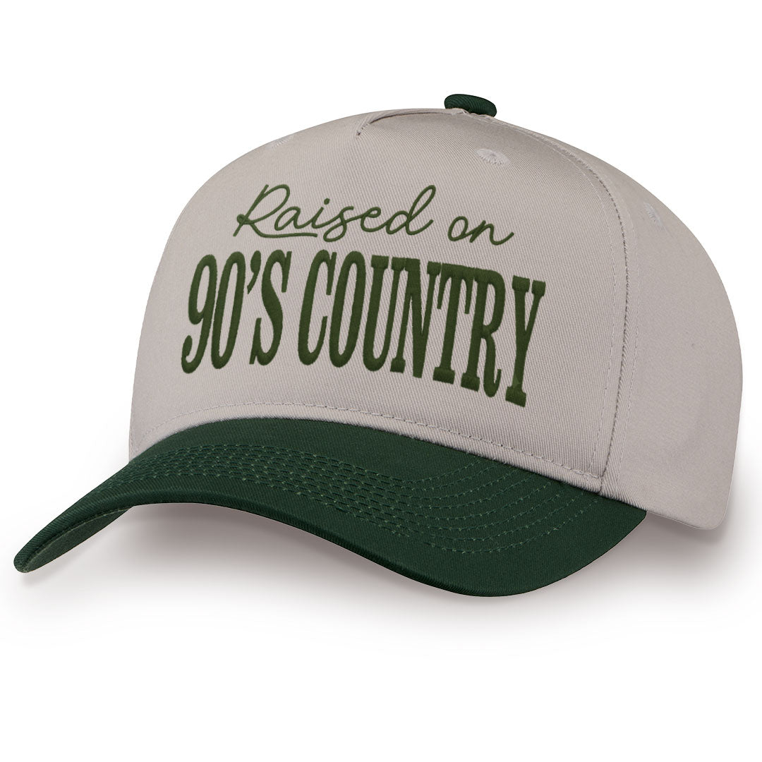 Green embroidered snapback hat with Raised On 90's Country stitched across the front