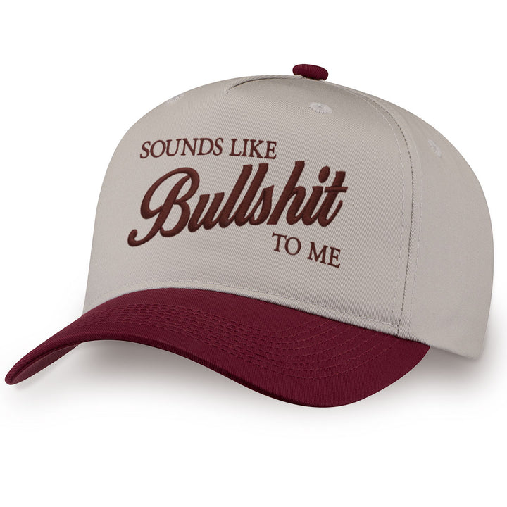 Burgundy embroidered snapback hat with Sounds Like Bullshit stitched across the front