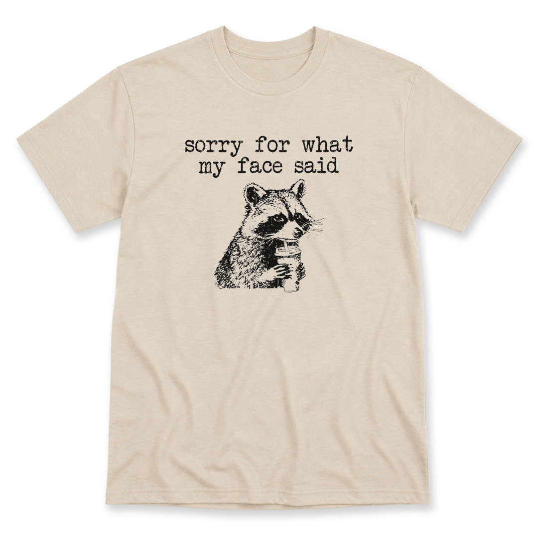Sand t-shirt printed with the Sorry For What My Face Said design, by Pinetree Innovations