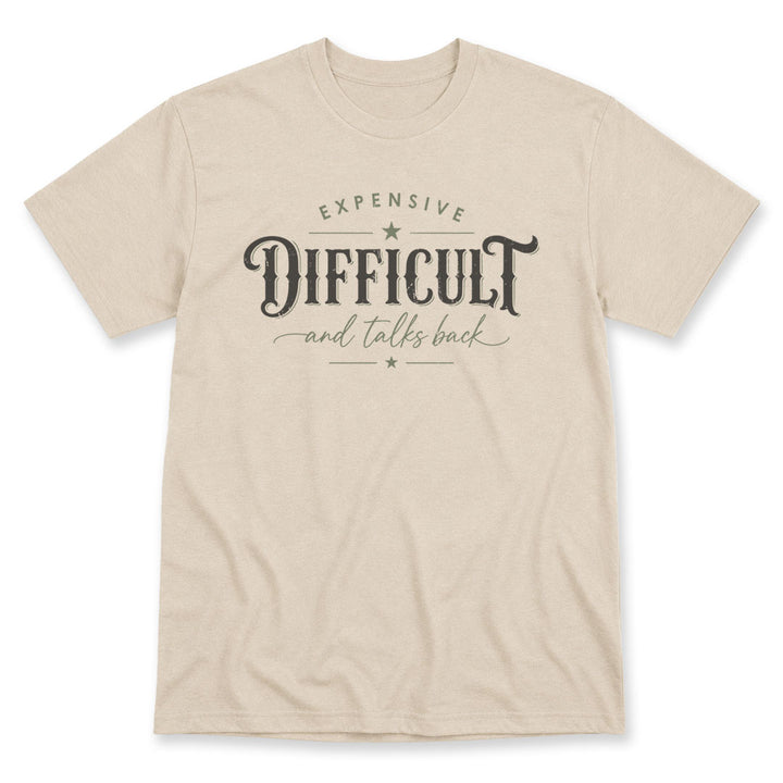 Sand t-shirt printed with the Expensive Difficult And Talks Back design, by Pinetree Innovations