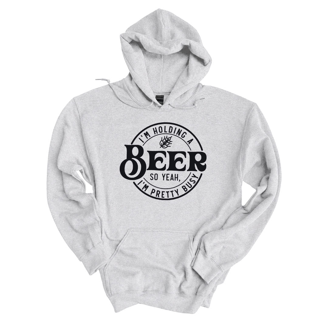 Ash hoodie printed with the Im Holding A Beer design across the front