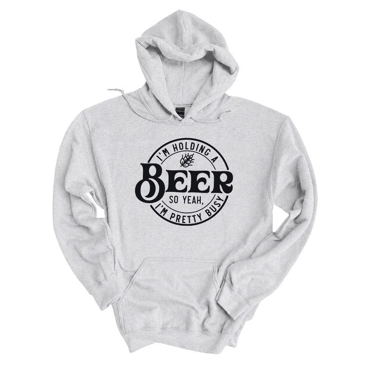 Ash hoodie printed with the Im Holding A Beer design across the front