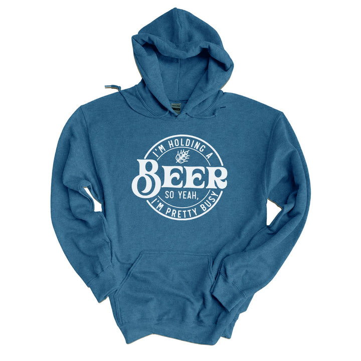 Indigo Blue hoodie printed with the Im Holding A Beer design across the front