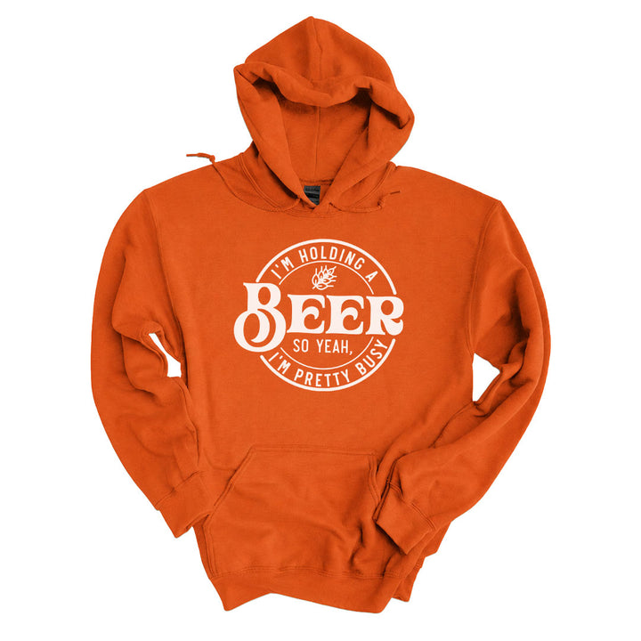 Texas Orange hoodie printed with the Im Holding A Beer design across the front