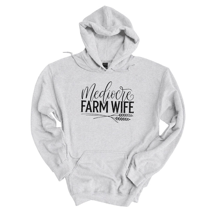 Ash hoodie with the Mediocre Farm Wife design printed across the front