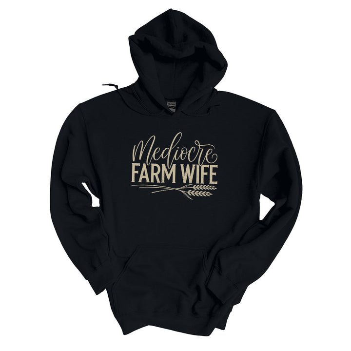 Black hoodie with the Mediocre Farm Wife design printed across the front