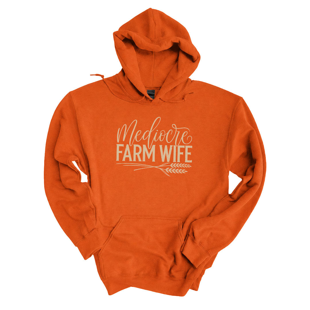 Texas Orange hoodie with the Mediocre Farm Wife design printed across the front