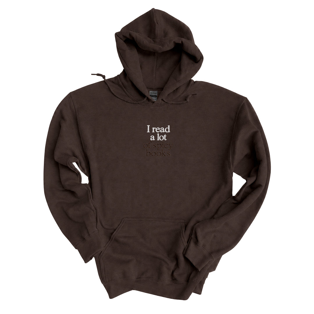 Dark Chocolate hoodie embroidered with I read a lot in white thread and of spicy books in tonal thread below