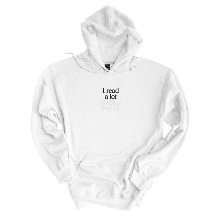 White hoodie embroidered with I read a lot in black thread and of spicy books in tonal thread below