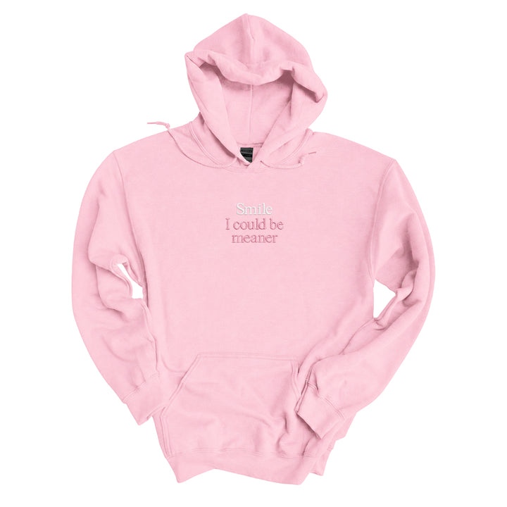 Light Pink hoodie embroidered with Smile in white thread and I could be meaner in tonal thread below