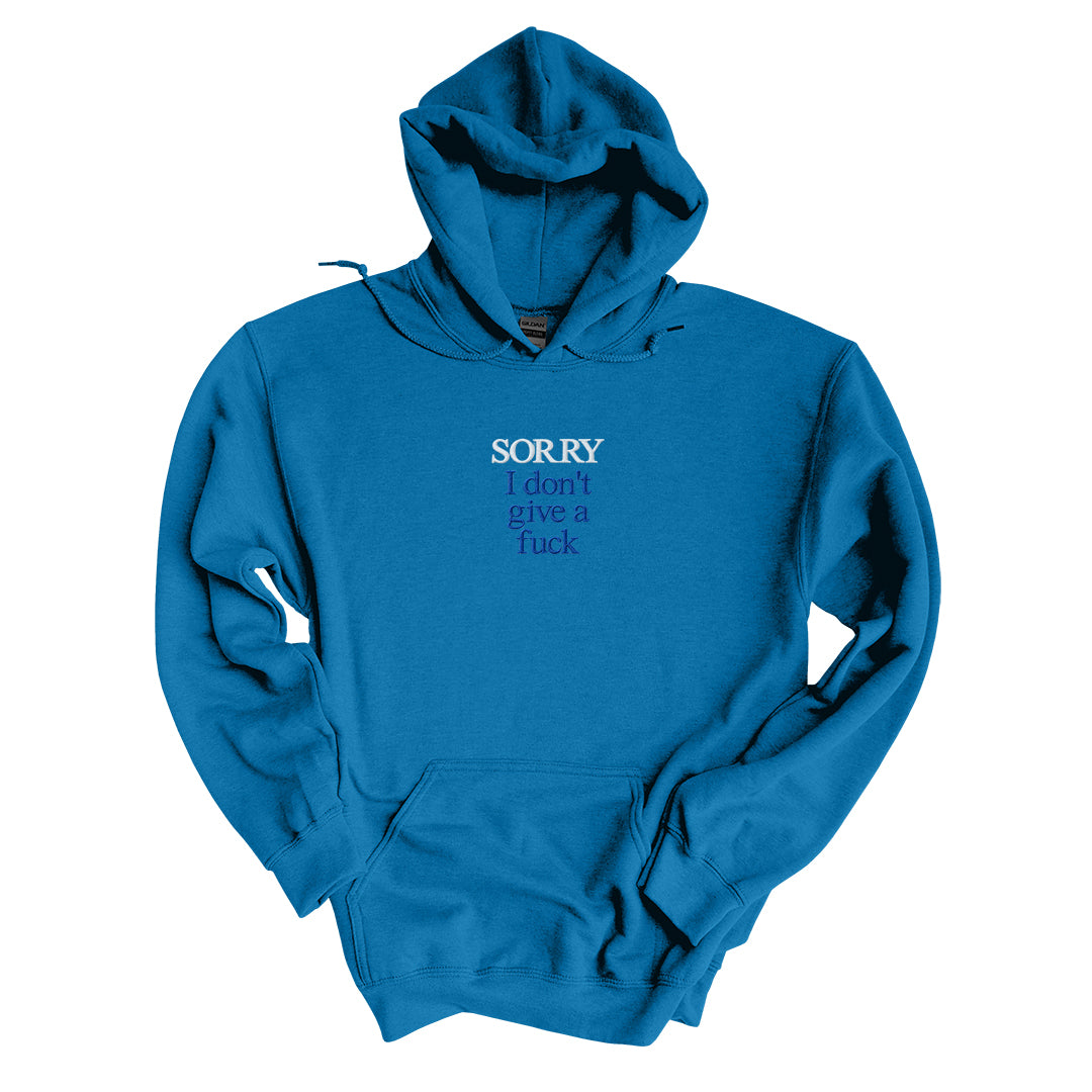 Sapphire hoodie embroidered with Sorry in white thread and I don&