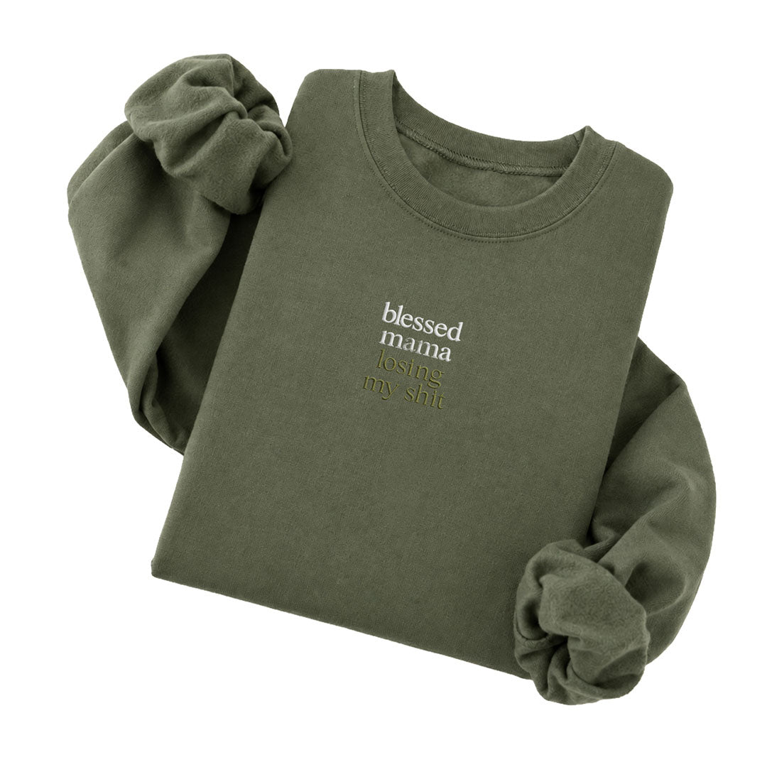 Military Green crewneck sweatshirt embroidered with Blessed mama in white thread and losing my shit in tonal thread below