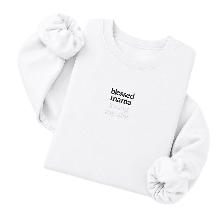 White crewneck sweatshirt embroidered with Blessed mama in black thread and losing my shit in tonal thread below