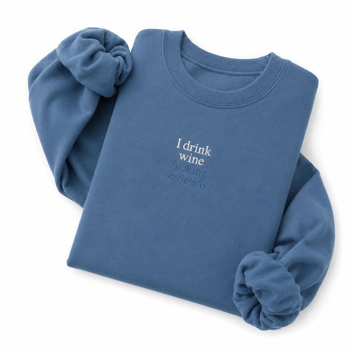 Indigo Blue crewneck sweatshirt embroidered with I drink wine in white thread and fucking obviously in tonal thread below