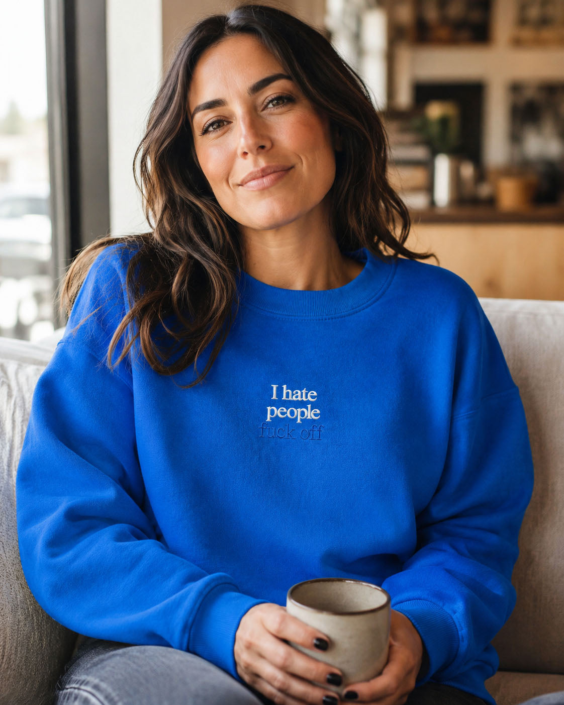 Close-up of I hate people fuck off embroidery on a Properly Improper crewneck sweatshirt