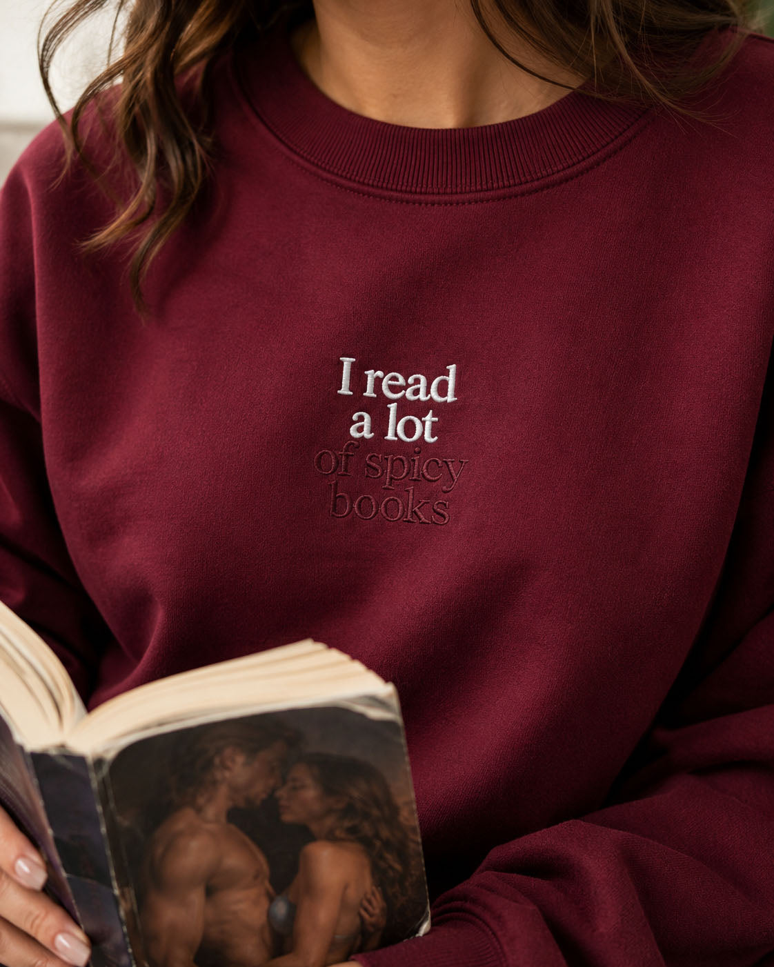 I Read A Lot Of Spicy Books embroidered crewneck sweatshirt by Pinetree Innovations in Saskatoon