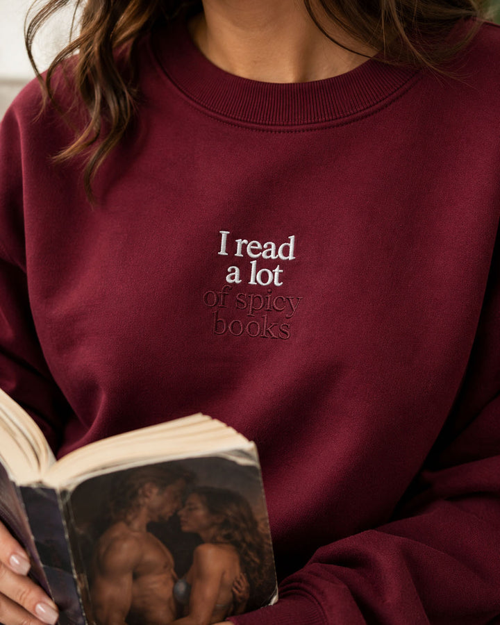 I Read A Lot Of Spicy Books embroidered crewneck sweatshirt by Pinetree Innovations in Saskatoon