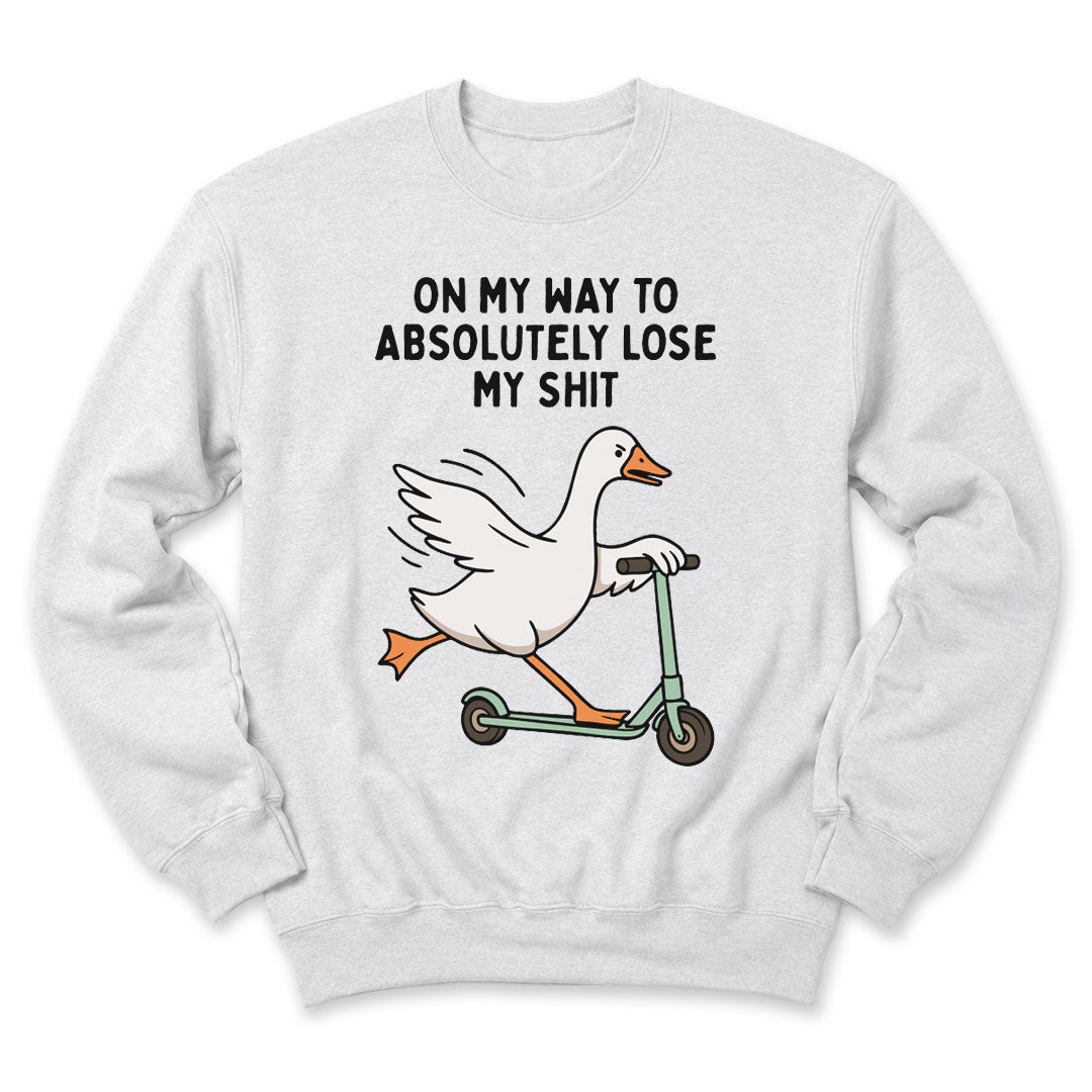 Ash crewneck sweatshirt printed with "On My Way To Absolutely Lose My Shit" across the front