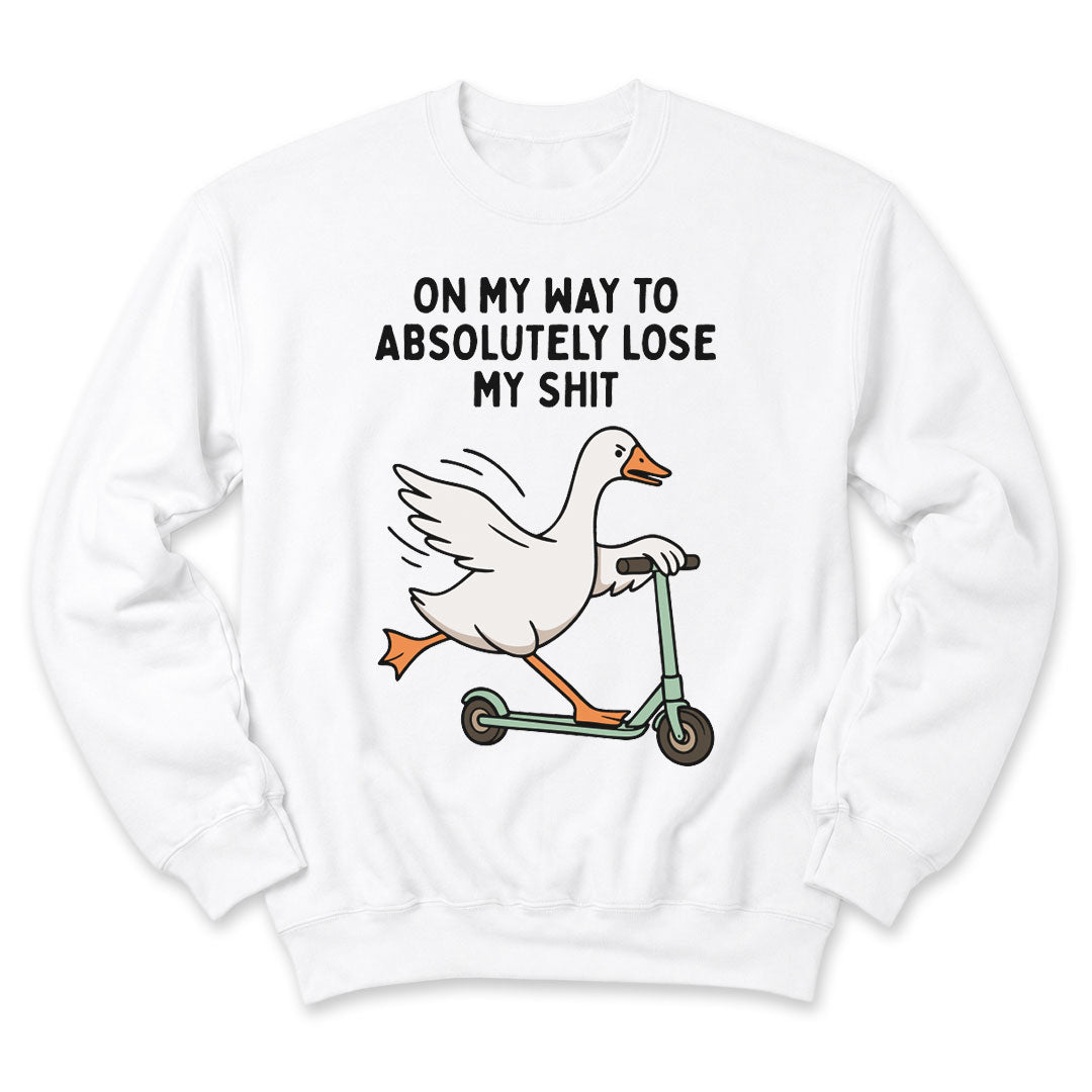 White crewneck sweatshirt printed with "On My Way To Absolutely Lose My Shit" across the front