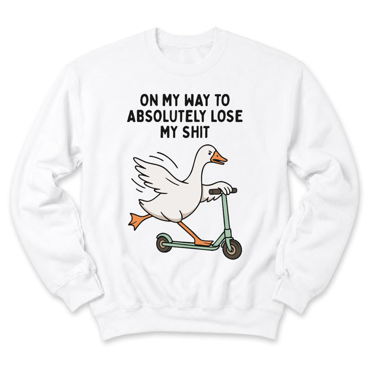 White crewneck sweatshirt printed with "On My Way To Absolutely Lose My Shit" across the front