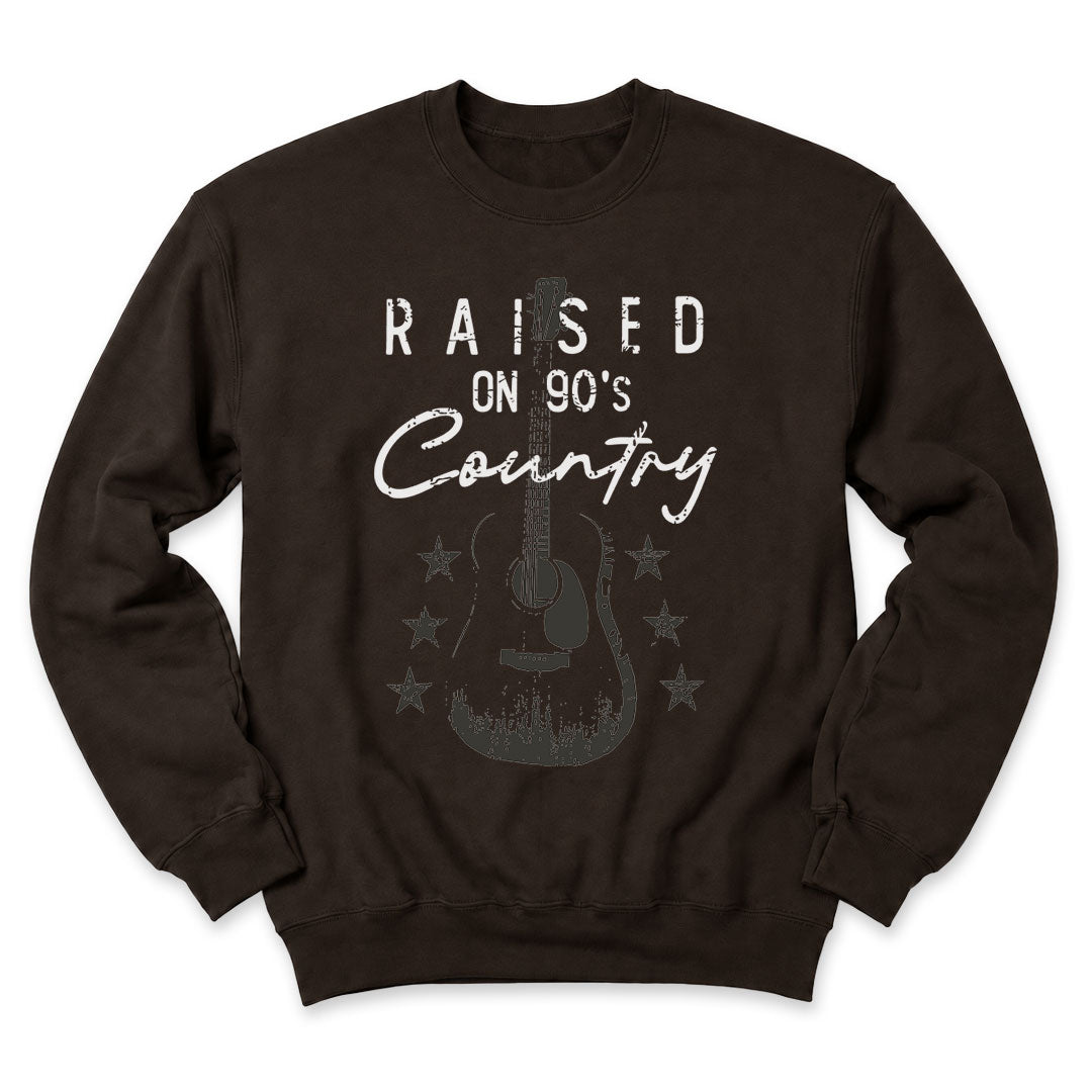 Dark Chocolate crewneck sweatshirt printed with "Raised on 90's Country" across the front