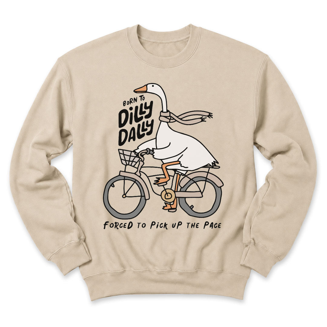Sand crewneck sweatshirt printed with "Born to dilly dally, forced to pick up the pace" across the front