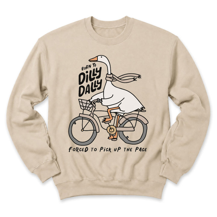 Sand crewneck sweatshirt printed with "Born to dilly dally, forced to pick up the pace" across the front
