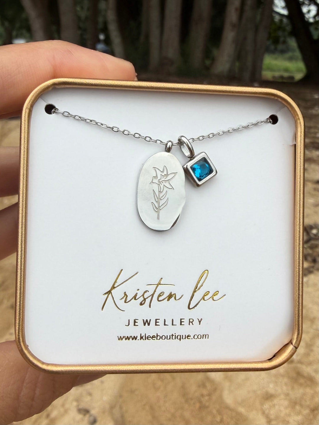 Silver birth month flower necklace in Kristen Lee Jewellery gift box