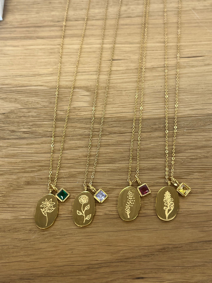 Gold birth month flower necklaces with birthstone charms