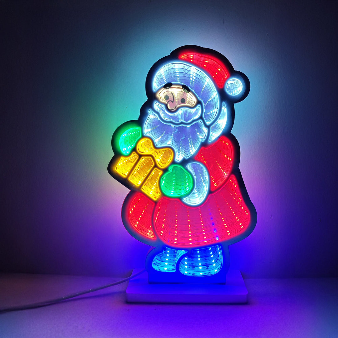 LED infinity mirror light in the shape of Santa in a red coat holding a gift