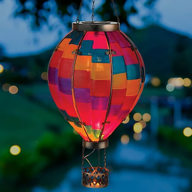 Hot air balloon solar lights glowing outdoors at night