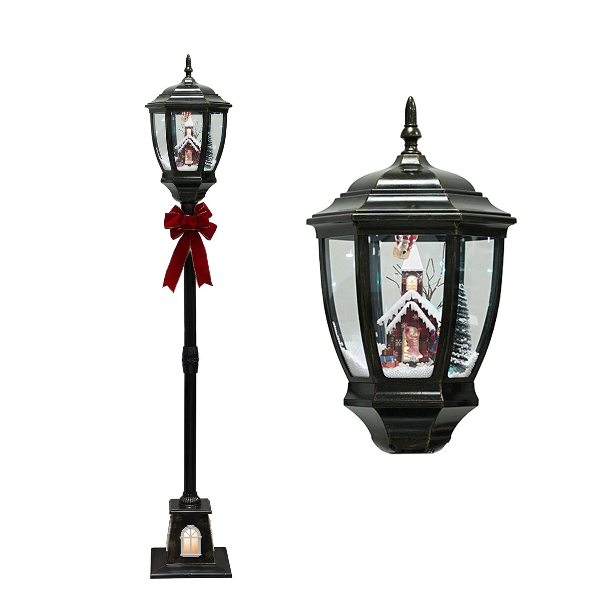 Tall black metal floor lantern with lit cottage and airship balloon winter scene