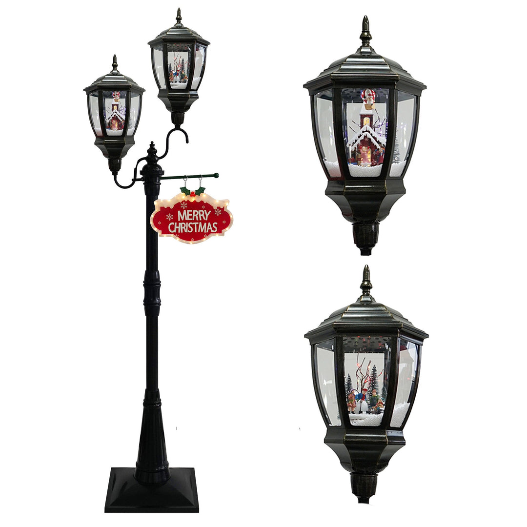 Tall black S-shaped floor lantern with falling snow effect and lit winter scenes
